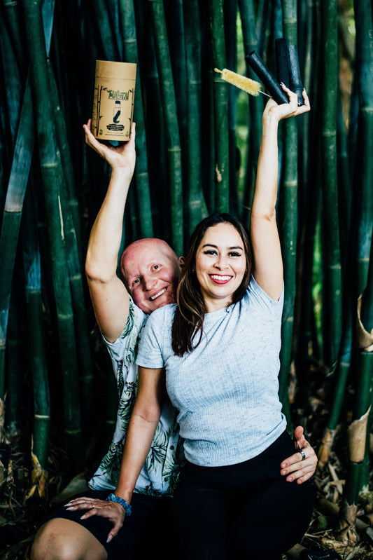 Founder of Natural Filters Igor Pershin with his wife holding up charcoal water filters